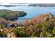 Aerial view of lakefront home nestled among trees and offering water access at 800 Lakeview Shores Loop, Mooresville, NC 28117