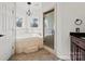 Bathroom with corner soaking tub, glass shower, and granite flooring at 800 Lakeview Shores Loop, Mooresville, NC 28117