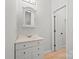 Clean bathroom with vanity, mirror, and access to another room at 800 Lakeview Shores Loop, Mooresville, NC 28117