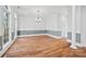 Spacious dining room with hardwood floors and chandelier at 800 Lakeview Shores Loop, Mooresville, NC 28117