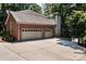 Two-car garage with attached brick home at 800 Lakeview Shores Loop, Mooresville, NC 28117