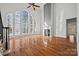 Large living room with hardwood floors, fireplace, and lake view at 800 Lakeview Shores Loop, Mooresville, NC 28117