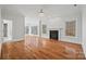 Bright main bedroom with hardwood floors, fireplace, and access to a luxurious bathroom at 800 Lakeview Shores Loop, Mooresville, NC 28117