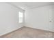 Bright bedroom with neutral carpet, a window letting in natural light, and a closet at 980 Von Buren Blvd, Rock Hill, SC 29730