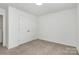 Carpeted bedroom with double door closet and a window for natural lighting at 980 Von Buren Blvd, Rock Hill, SC 29730