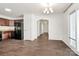 Bright dining area with dark floors, adjacent kitchen, and sliding glass doors leading to outdoor space at 980 Von Buren Blvd, Rock Hill, SC 29730