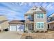 Inviting two-story home with stone accents, a two-car garage, and manicured front yard at 980 Von Buren Blvd, Rock Hill, SC 29730