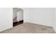 Hallway with plush carpeting and a staircase leading to the upper level of the home at 980 Von Buren Blvd, Rock Hill, SC 29730