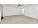 Bright living room featuring neutral carpet, a ceiling fan, and a large window at 980 Von Buren Blvd, Rock Hill, SC 29730