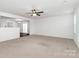 Spacious living room with neutral carpet and ceiling fan, perfect for entertaining or relaxing at 980 Von Buren Blvd, Rock Hill, SC 29730