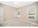 This bedroom has neutral paint, carpet, and a ceiling fan at 180 Sink Farm Rd, Mooresville, NC 28115