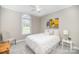 Cozy bedroom with a window, chair, neutral walls, and soft carpeting at 180 Sink Farm Rd, Mooresville, NC 28115