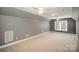 Spacious bonus room with vaulted ceilings, carpeted floor, and large windows at 180 Sink Farm Rd, Mooresville, NC 28115