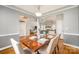 Elegant dining room featuring a wood table set for dinner and hardwood floors at 180 Sink Farm Rd, Mooresville, NC 28115