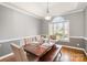 Formal dining room featuring a large window and an elegant chandelier at 180 Sink Farm Rd, Mooresville, NC 28115