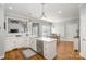 Well-lit kitchen with a view to the dining area and stainless appliances at 180 Sink Farm Rd, Mooresville, NC 28115