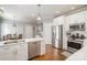 Bright kitchen with stainless steel appliances and white cabinets at 180 Sink Farm Rd, Mooresville, NC 28115