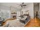 Inviting living room featuring a stone fireplace and hardwood floors at 180 Sink Farm Rd, Mooresville, NC 28115