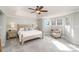 Serene main bedroom with a tray ceiling, plush carpet, and an abundance of natural light at 180 Sink Farm Rd, Mooresville, NC 28115