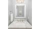 Stylish powder room featuring a marble countertop and modern fixtures at 180 Sink Farm Rd, Mooresville, NC 28115