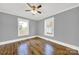 Spacious bedroom with hardwood floors, neutral walls, and ceiling fan at 306 S Jones Ave, Rock Hill, SC 29730