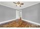Spacious bedroom with hardwood floors, neutral gray walls and ceiling fan at 306 S Jones Ave, Rock Hill, SC 29730
