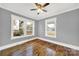 Well-lit bedroom with hardwood floors, neutral walls, and ceiling fan at 306 S Jones Ave, Rock Hill, SC 29730