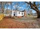 Newly renovated white house with a spacious yard and wooden fence at 306 S Jones Ave, Rock Hill, SC 29730