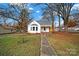 Newly renovated white house with a front porch and yard at 306 S Jones Ave, Rock Hill, SC 29730