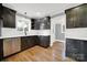 Modern kitchen with dark cabinetry, white subway tile backsplash, and stainless steel appliances at 306 S Jones Ave, Rock Hill, SC 29730