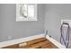 Small laundry room with wood flooring and a window at 306 S Jones Ave, Rock Hill, SC 29730