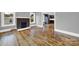 Spacious living room with gleaming hardwood floors and classic brick fireplace at 306 S Jones Ave, Rock Hill, SC 29730