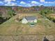 Green home with pool and large yard in an open aerial landscape view at 3798 Red Doc Rd, Lancaster, SC 29720