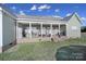 Back porch with sturdy support beams, patio seating and a grill at 3798 Red Doc Rd, Lancaster, SC 29720