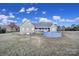 Expansive backyard featuring a large pool and home exterior with green siding at 3798 Red Doc Rd, Lancaster, SC 29720