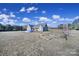 Wide backyard features an above-ground pool, green grass, and outdoor furniture at 3798 Red Doc Rd, Lancaster, SC 29720