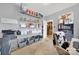 Versatile bedroom with storage shelves, printer and a view into the home's kitchen at 3798 Red Doc Rd, Lancaster, SC 29720