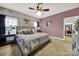 Comfortable bedroom with neutral tones, a ceiling fan, and ample natural light at 3798 Red Doc Rd, Lancaster, SC 29720