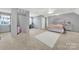 Spacious bedroom with plush carpeting, ample closet space and modern gray interior design at 3798 Red Doc Rd, Lancaster, SC 29720