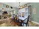 Inviting dining room with large windows and spacious table, flowing to the living room beyond at 3798 Red Doc Rd, Lancaster, SC 29720