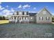 Charming exterior view of a beautiful home featuring a welcoming front porch and well-maintained lawn at 3798 Red Doc Rd, Lancaster, SC 29720