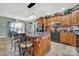 Spacious kitchen with a central island, wooden cabinetry, and modern appliances at 3798 Red Doc Rd, Lancaster, SC 29720