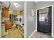 Functional laundry room with washer, dryer, sink, and storage shelves at 3798 Red Doc Rd, Lancaster, SC 29720