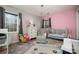 Pink bedroom with crib, chair, and dresser at 5328 Caradon Dr, Charlotte, NC 28227