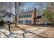 Two-story house with beige siding, green shutters, and a driveway at 5328 Caradon Dr, Charlotte, NC 28227