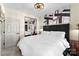 Relaxing bedroom featuring a King-size bed, modern ceiling fan, and wall art at 7108 Founders Club Ct, Charlotte, NC 28269