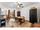Charming dining room with a wooden table, modern chairs, and access to the kitchen and backyard at 7108 Founders Club Ct, Charlotte, NC 28269