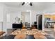 Open dining area showcasing modern furniture, natural light, and seamless access to the kitchen at 7108 Founders Club Ct, Charlotte, NC 28269