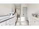 Bright hallway with closet, and a printer on top of a white dresser at 7108 Founders Club Ct, Charlotte, NC 28269