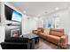 Contemporary living area showcasing a fireplace, comfortable seating, and a well-lit ambiance at 7108 Founders Club Ct, Charlotte, NC 28269